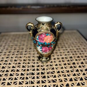 Elegant Black and Gold Vase with Floral Design